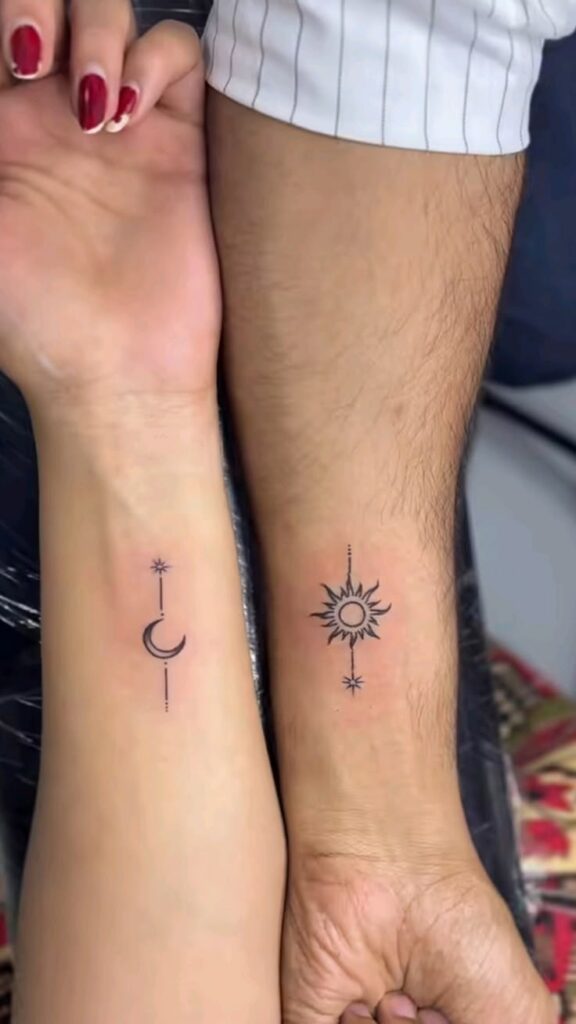 matching crescent moon and sun wrist tattoos, each with a tiny star, on two forearms